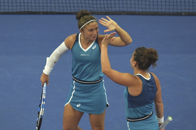 tennis wta madrid errani and paolini advance to the second round of doubles