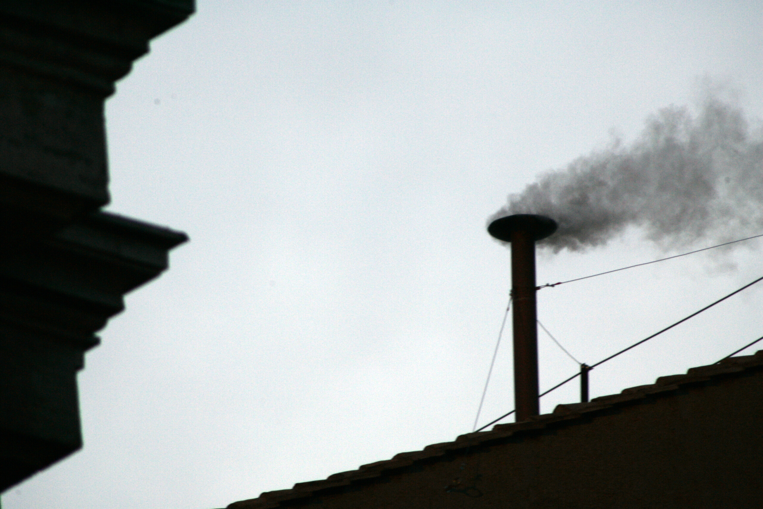 conclave chimney is being mounted on sistine chapel for the smoke to come out scaled