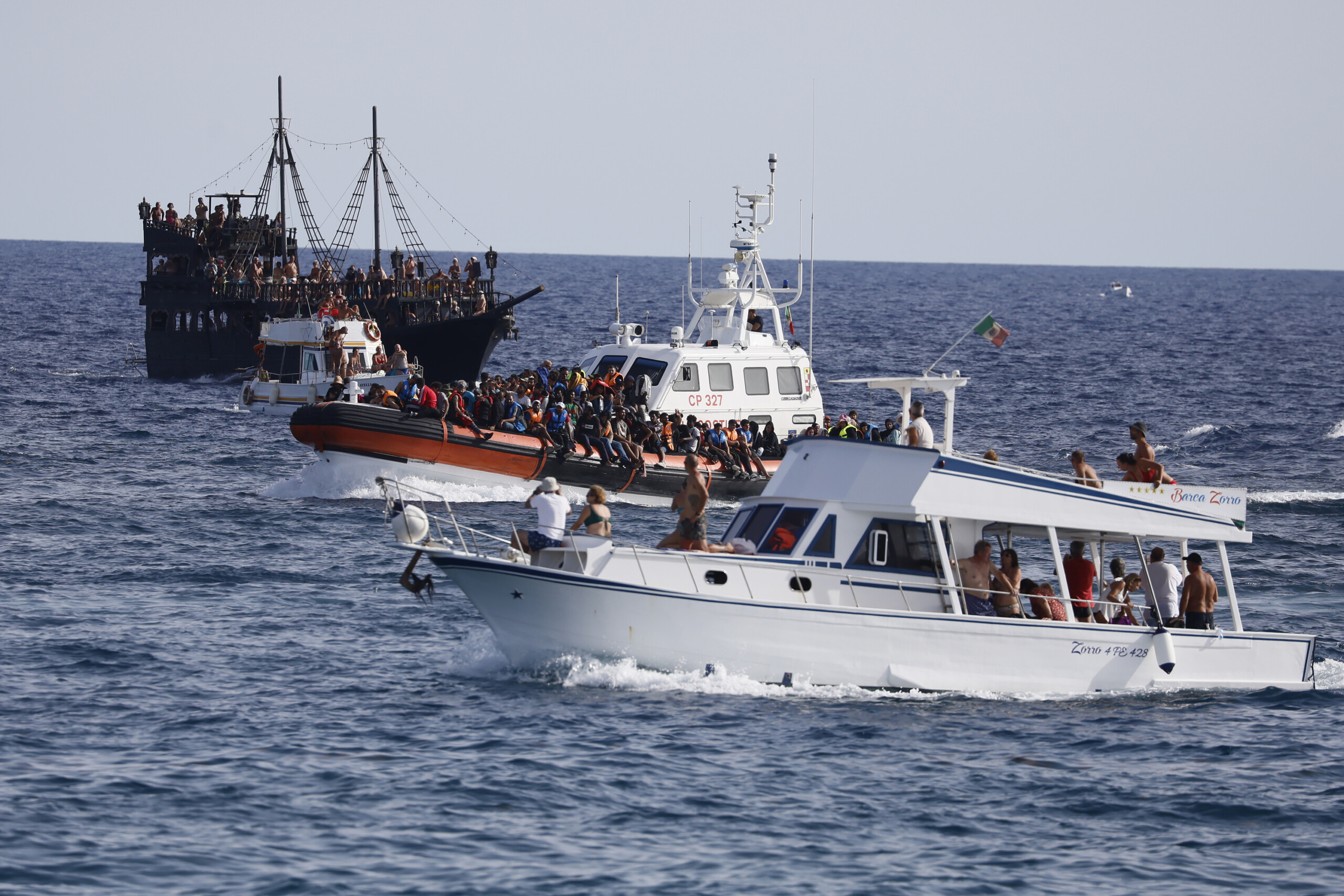 migrants rubber dinghy rescued off lampedusa three bodies recovered including two children scaled