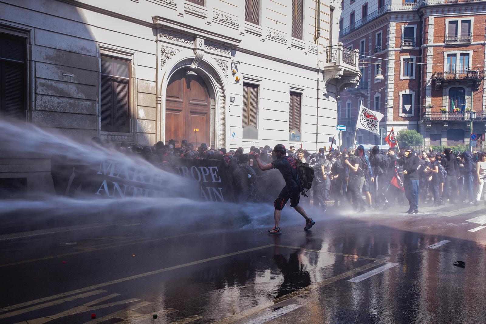 milan clashes between police and protesters at anti remigration march