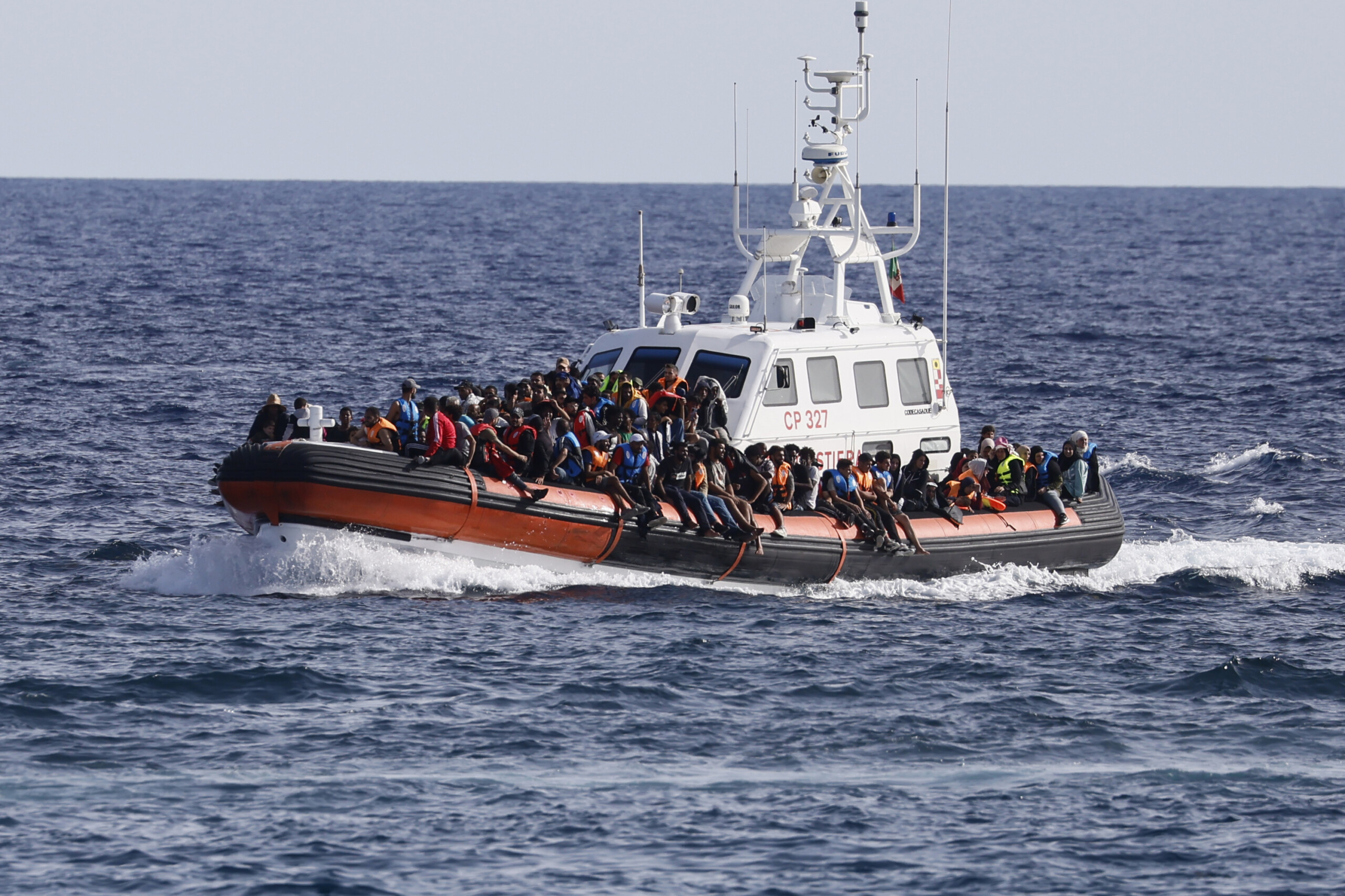 migrants 60 landed overnight in lampedusa 2 bodies also found on board scaled