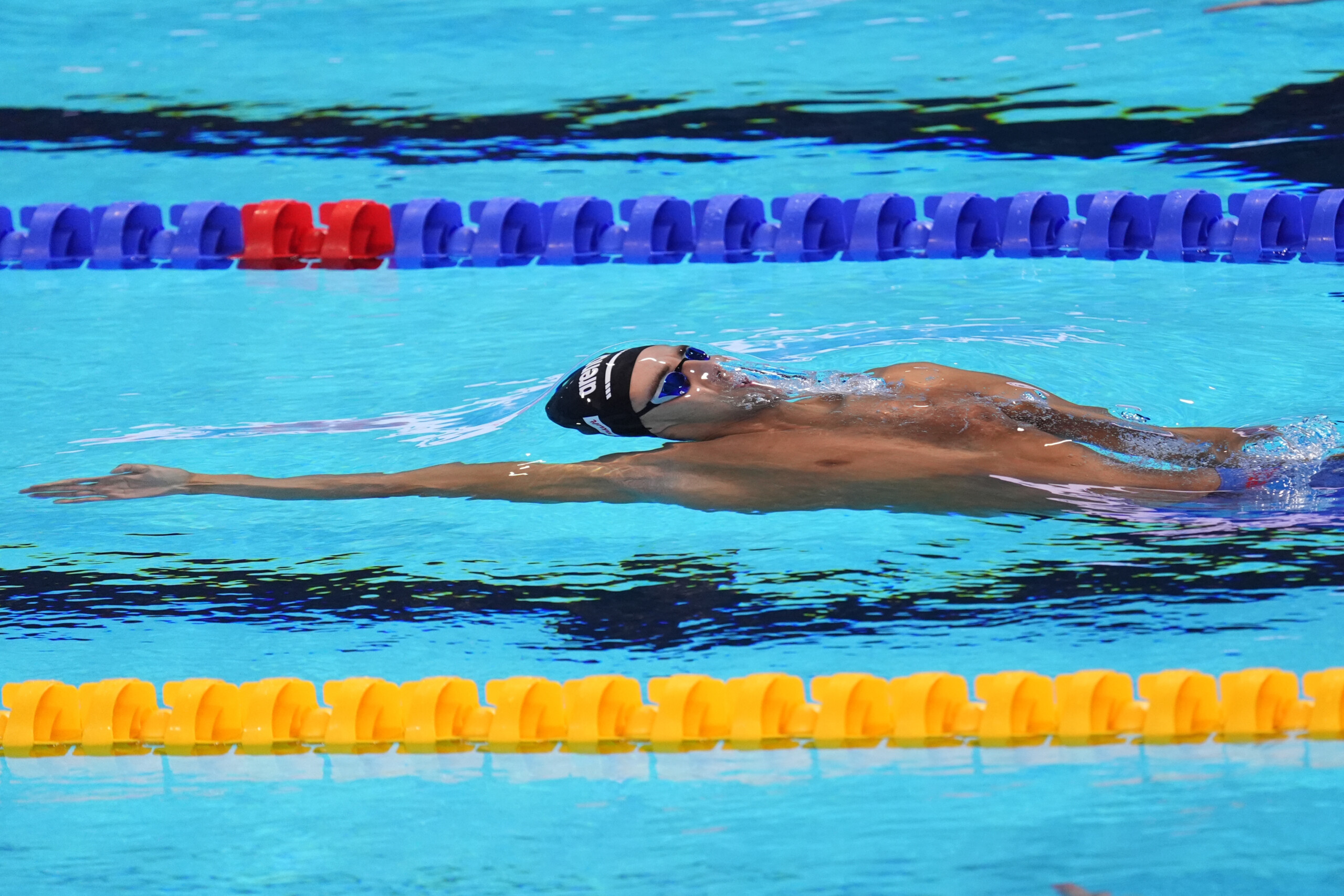 swimming ceccon second in the 100m backstroke in westmont scaled