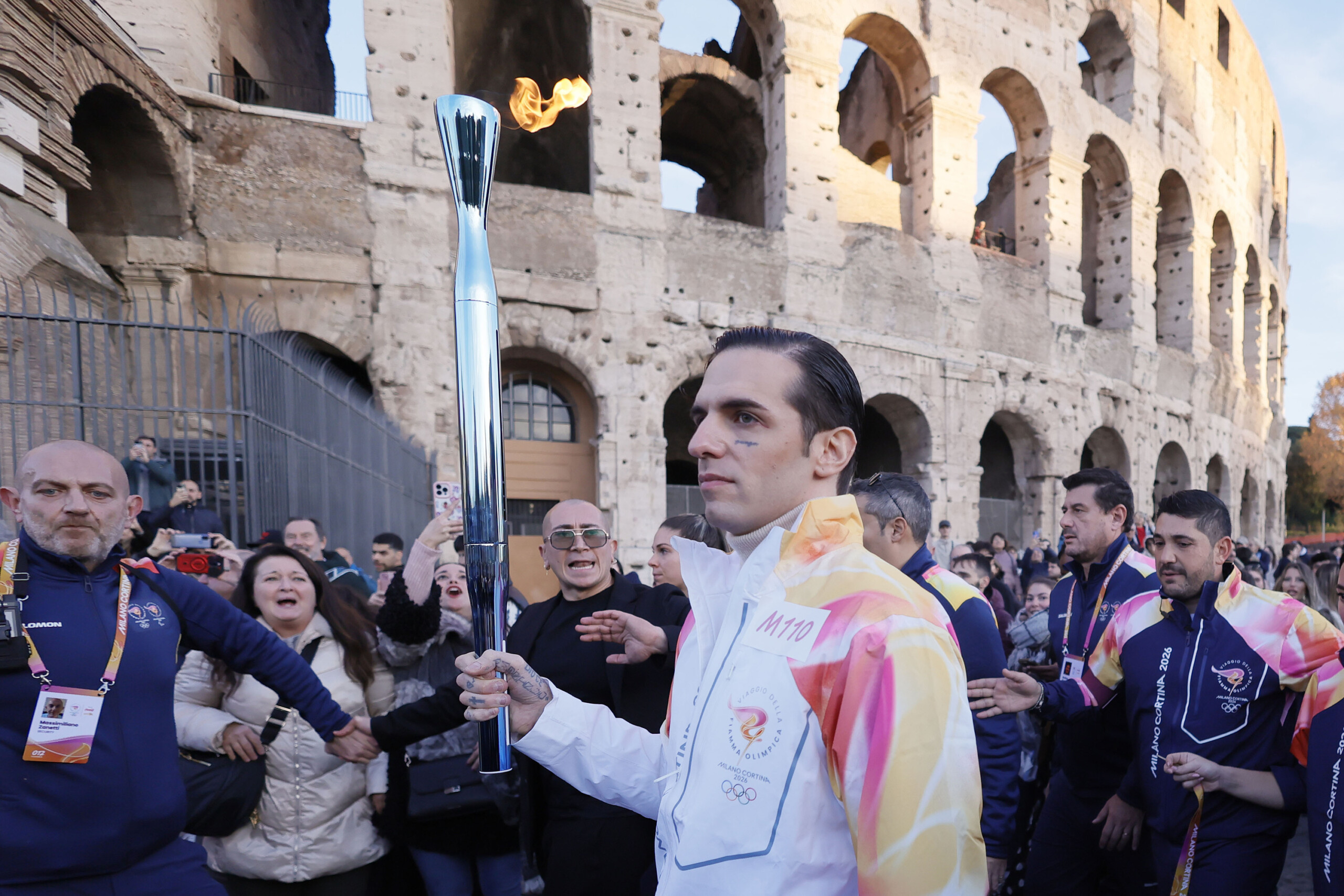 milan cortina achille lauro on stage at the closing ceremony scaled
