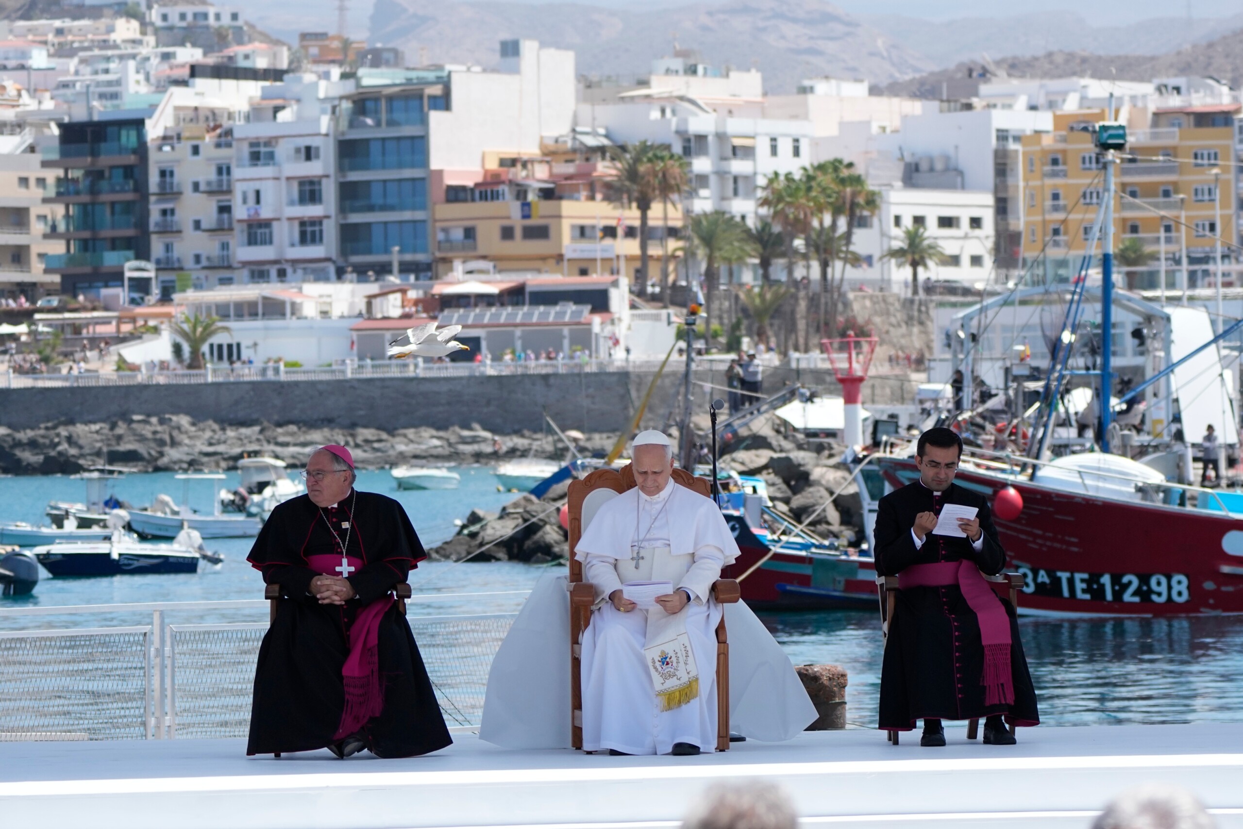 migrants pope arrives at the pier of shame in gran canaria with sanchez scaled