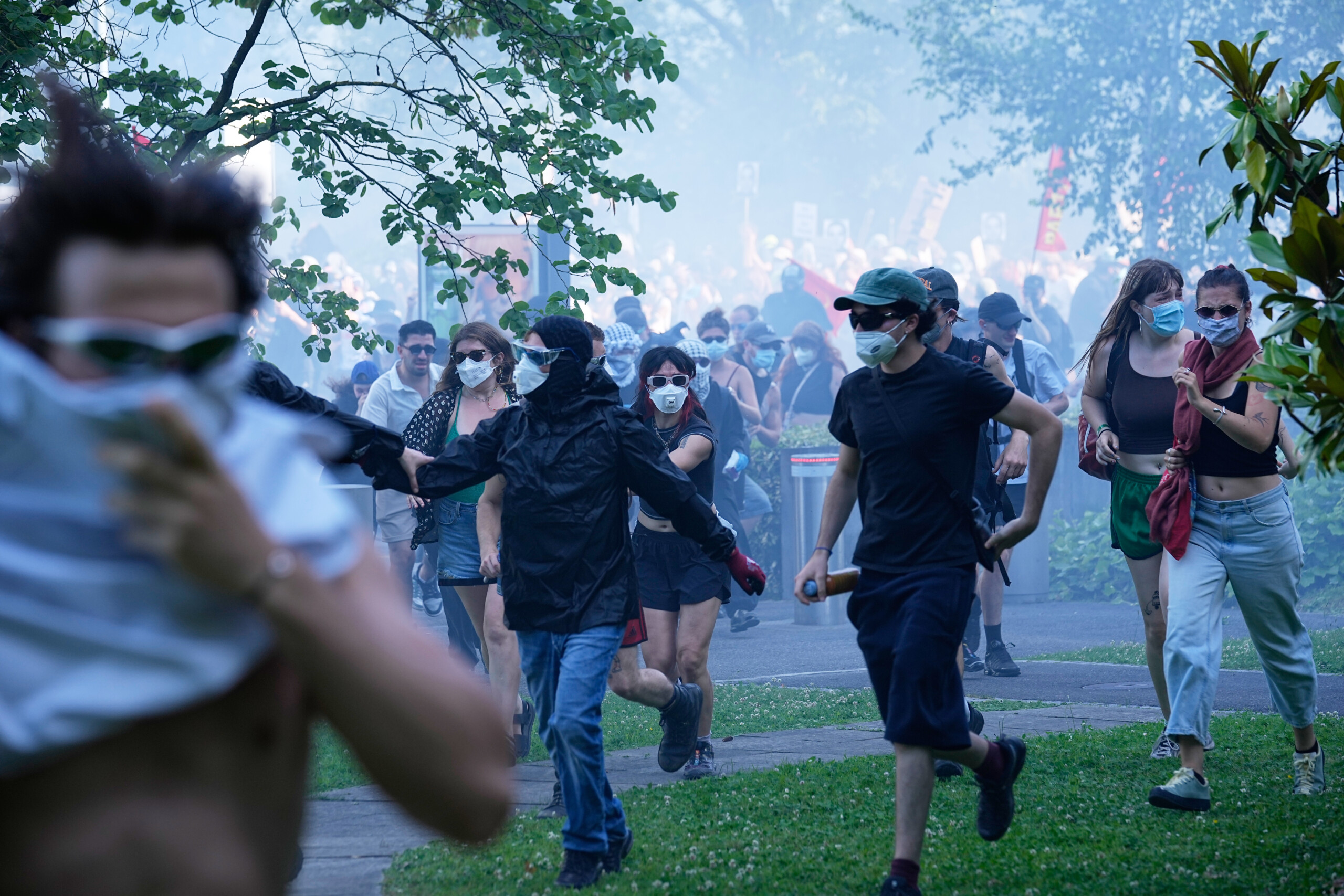 g7 thousands protest in geneva clashes with police scaled